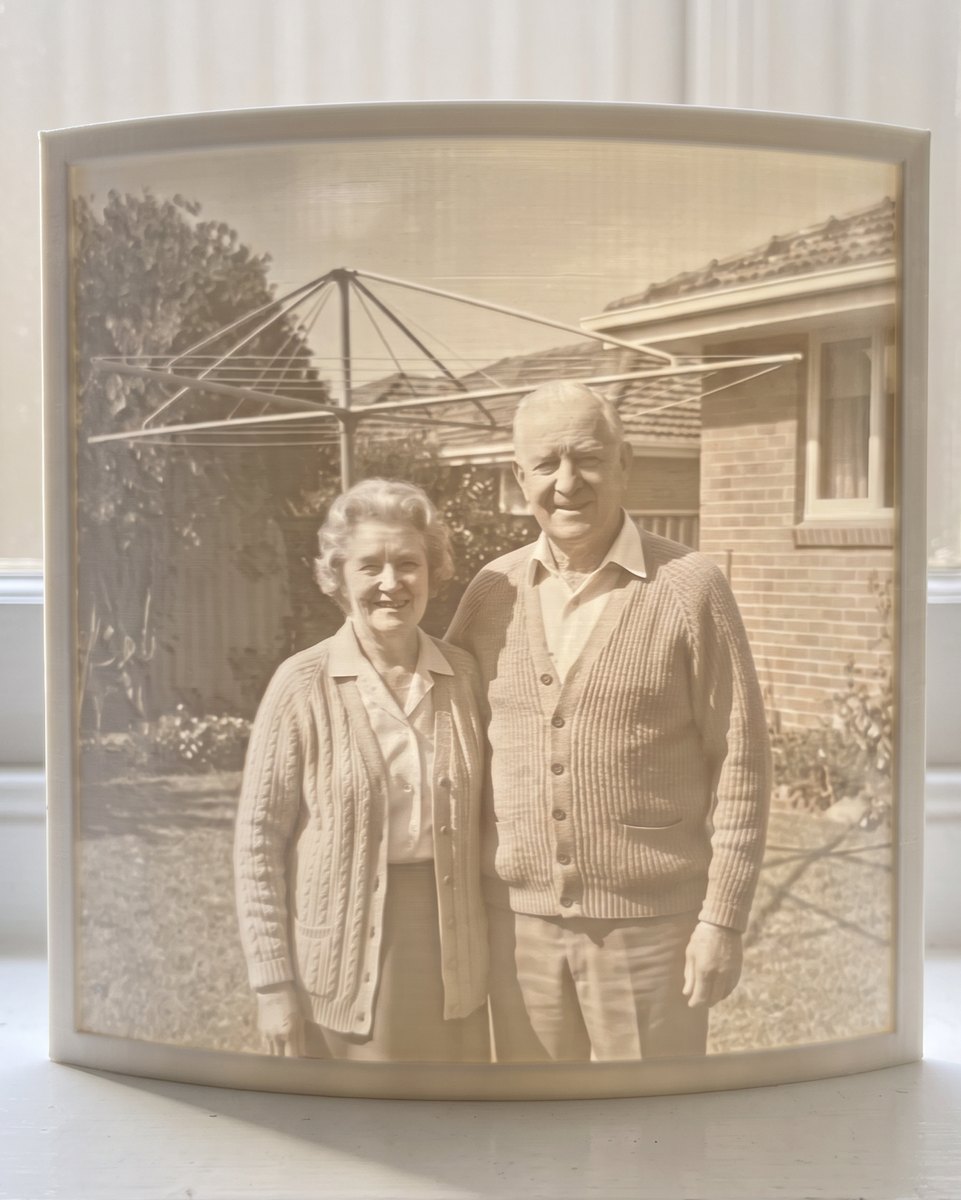 A restored old photo printed as a 3D Moment, glowing on a windowsill
